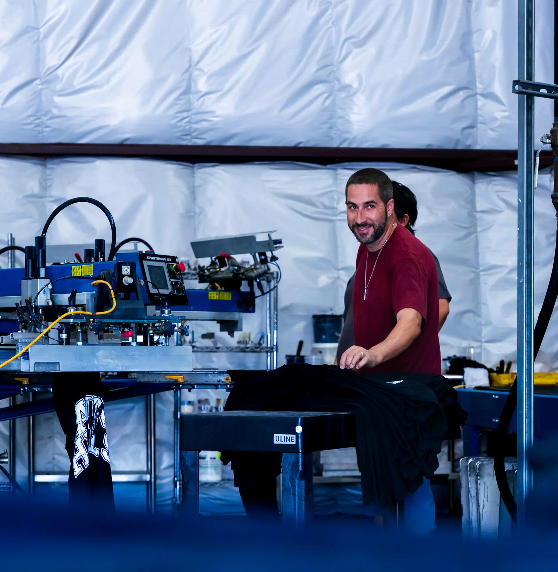 Team member at embroidery workstation