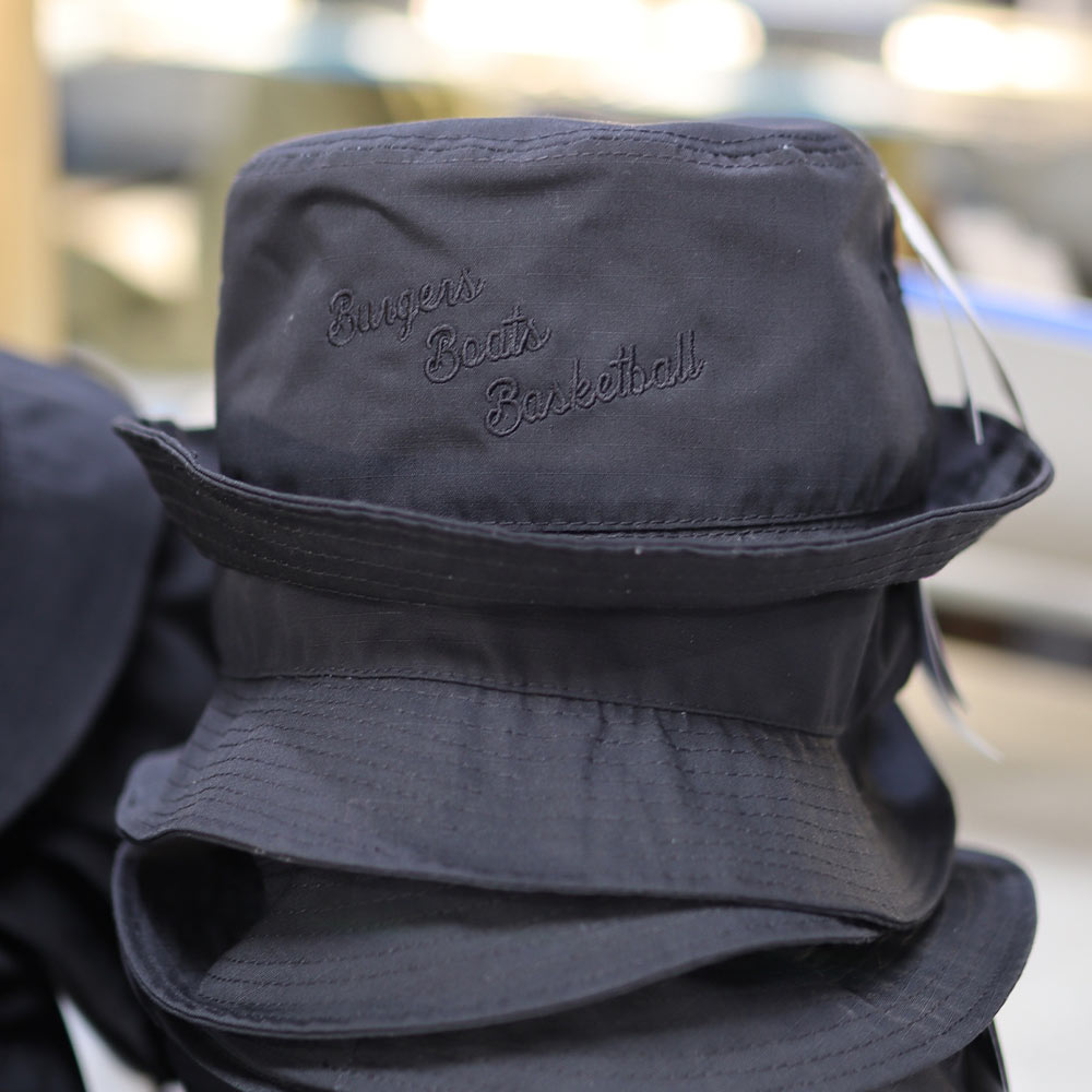 This photo is of a custom embroidery bucket hat​ in black