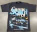 A black t-shirt with a graphic of a porsche car and palm trees, featuring the text "chasing 10's" and "excellence over epochs".