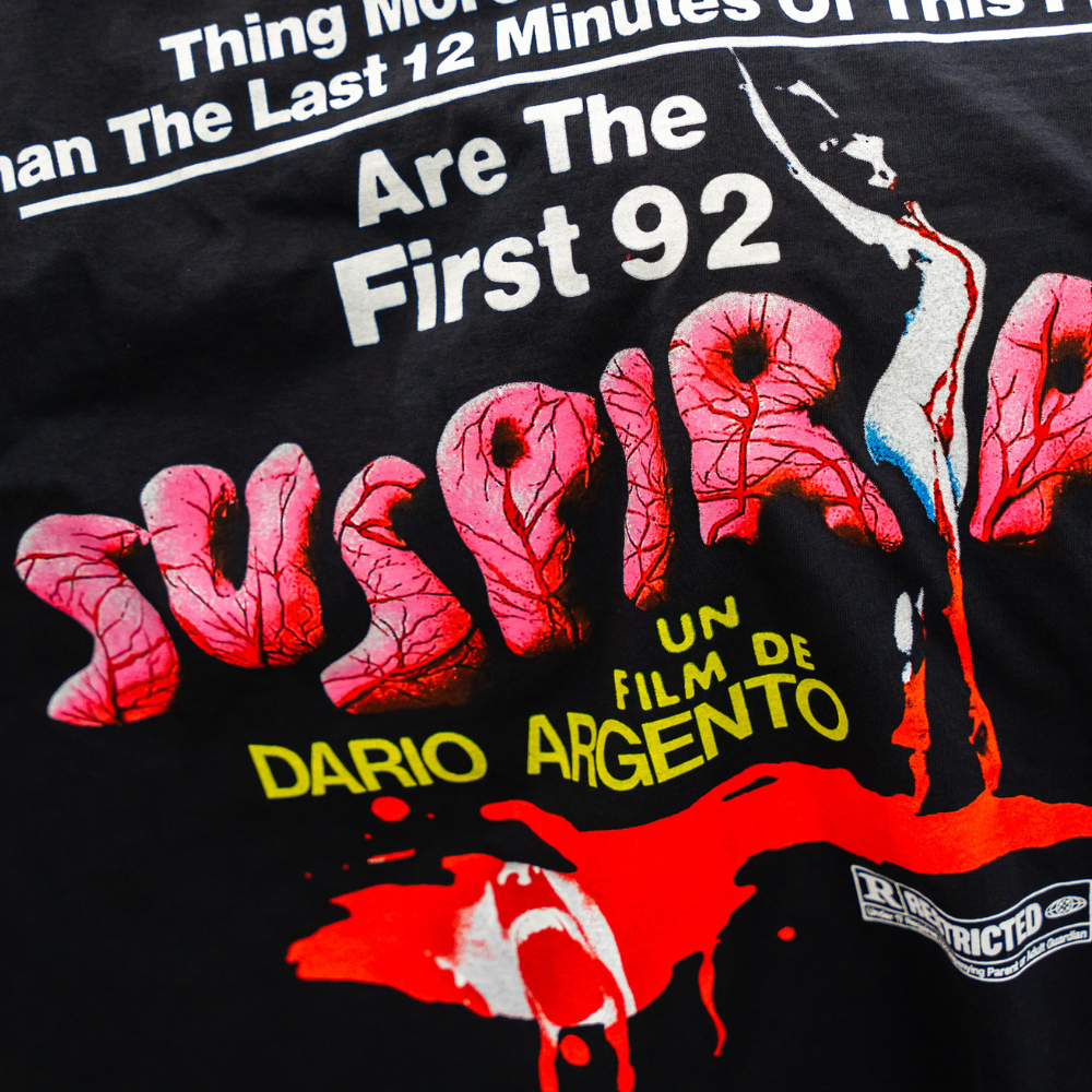 Zoomed in view of a black Los Angeles Apparel style 1807GD with a Suspiria movie design, featuring vibrant screen printing on the back by Garment Decor.