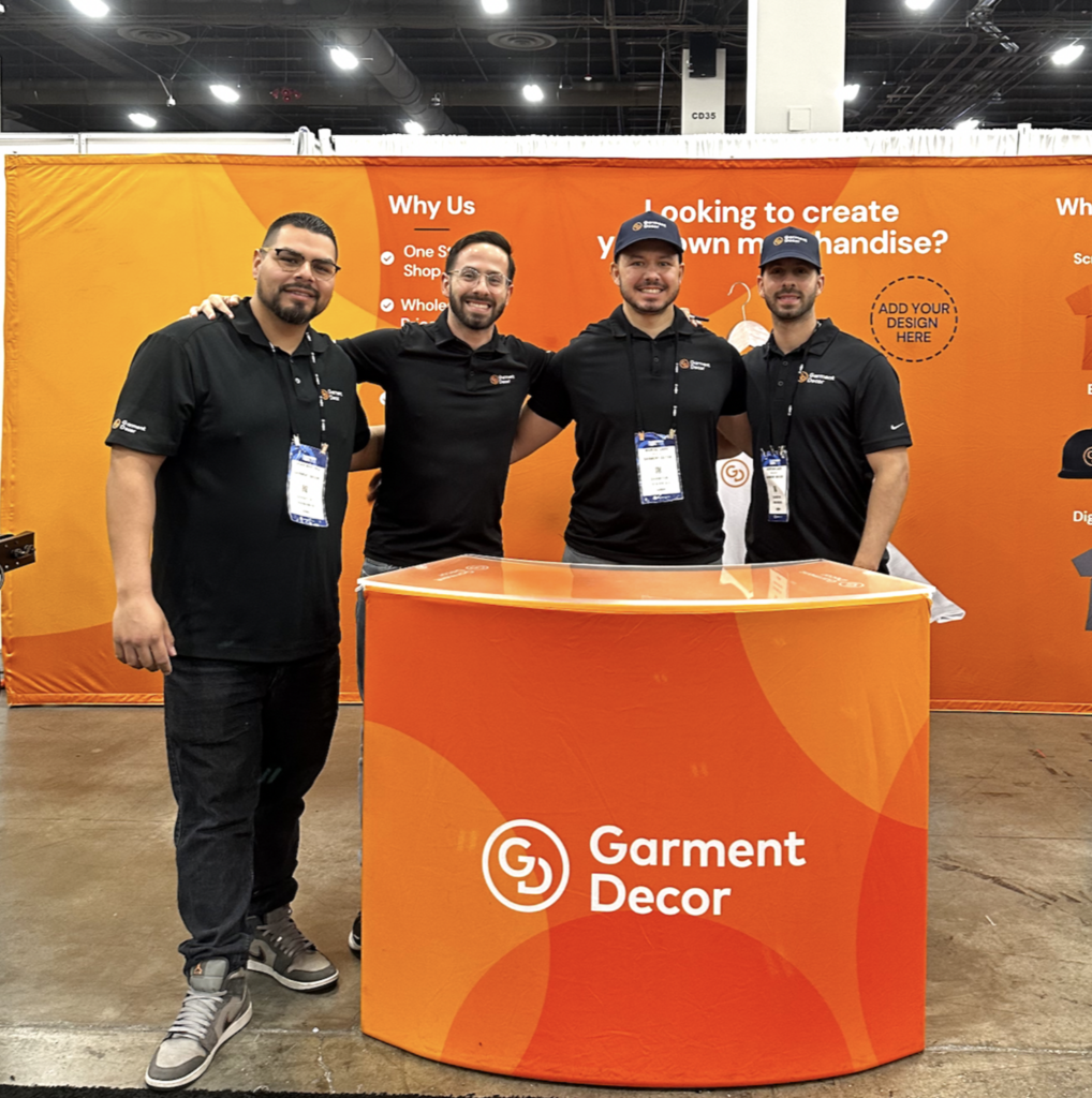 This is a photo of the Garment Decor team in front of their booth at the Las Vegas 2024 PPAI Promotional Merchandise Trade Show.