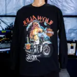 A mannequin showing the front view of black Gildan 5400 Heavy Cotton™ Long Sleeve T-Shirt with Julia Wolf wolf and motorcycle design, custom printed using digital squeegee technology by Garment Decor