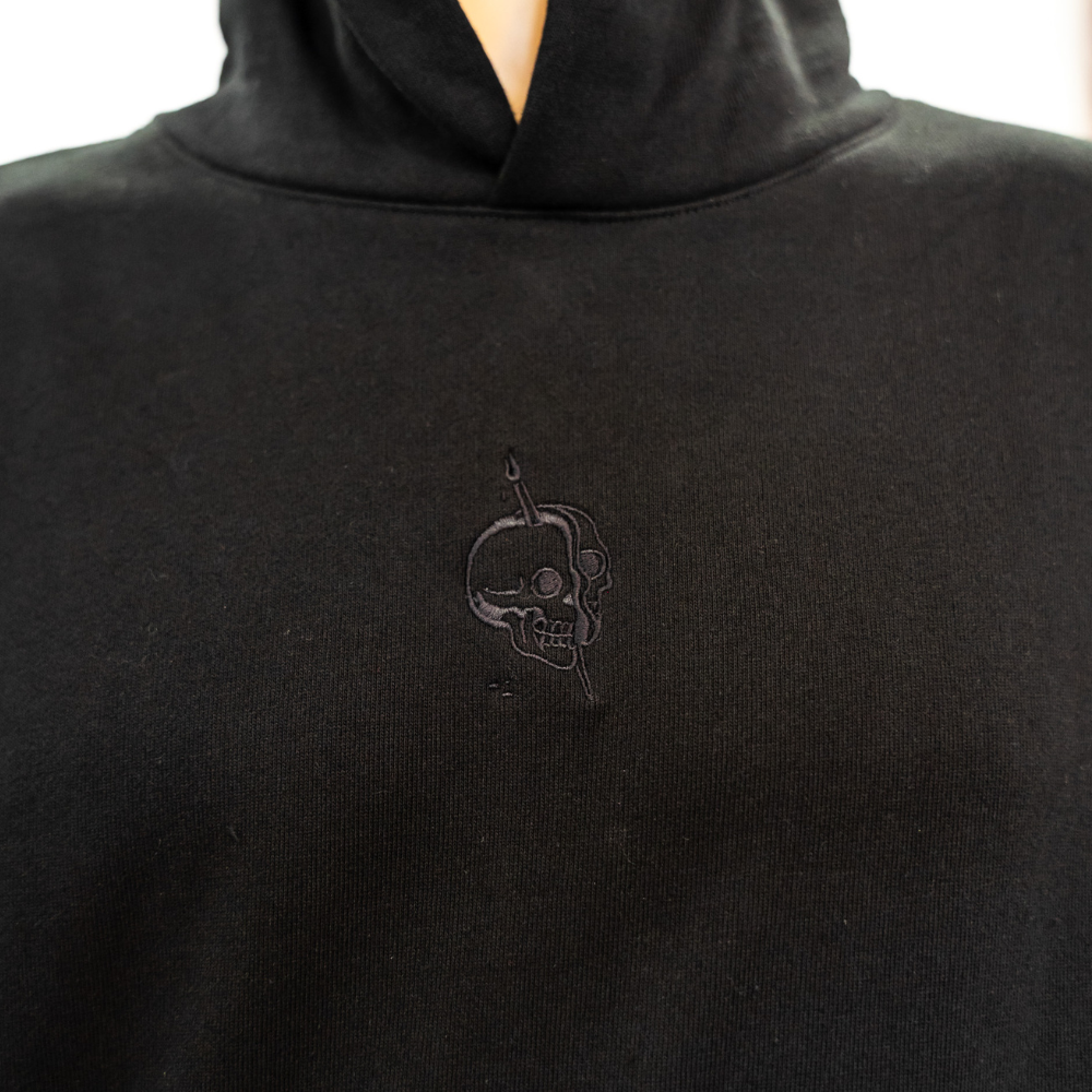 Front view of black IND420XD Independent Hoodie with custom embroidered logo for an artist brand