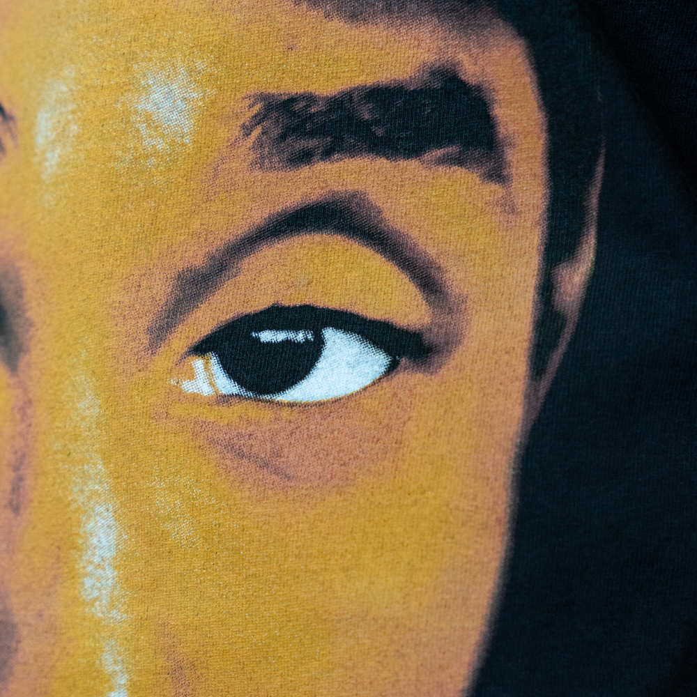 A close-up of the City of Champs Kobe Bryant design screen printed by Garment Decor on the LA Apparel 1801GD T-shirt, illustrating exceptional detail and vibrant colors that elevate streetwear branding.