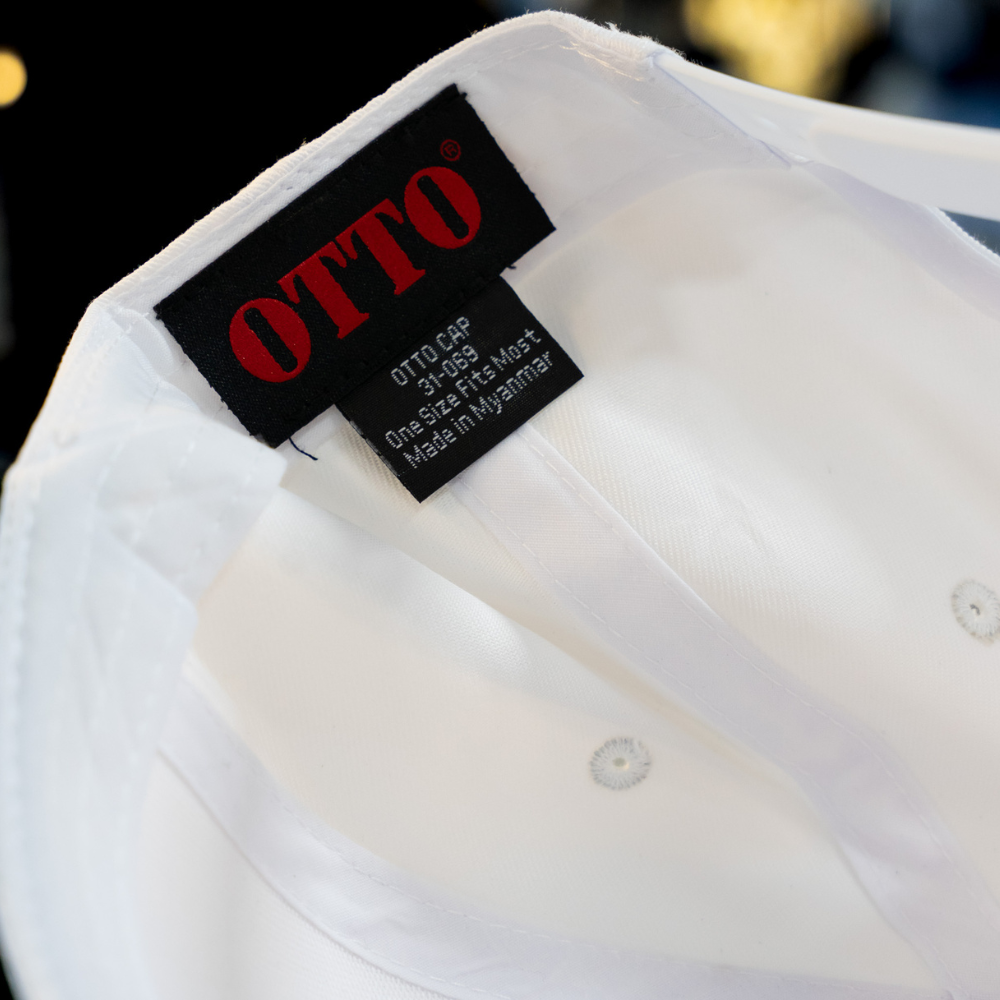 A close-up of the Otto Cap label on the 31-069 model, emphasizing the cap's premium quality and its appeal for custom branding in the streetwear market.